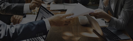 two people discussing documents